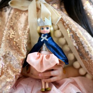 Girl holding Queen Of The Castle Lottie Doll