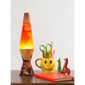 14.5” LAVA® Lamp Colormax Volcano – White/Tricolor on table with a smiley face pencil cup, notebook, giraffe figurines