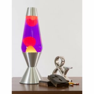 16.3” LAVA® Lamp – Yellow/Purple/Silver on a table with knick knacks