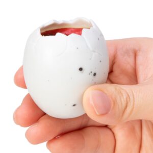 Squeezy Egg Popper toy in hand