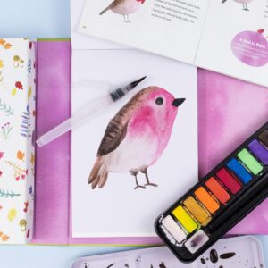 Tiger Tribe How to Paint Watercolor - Lifestyle shot of a watercolor painting of a bird