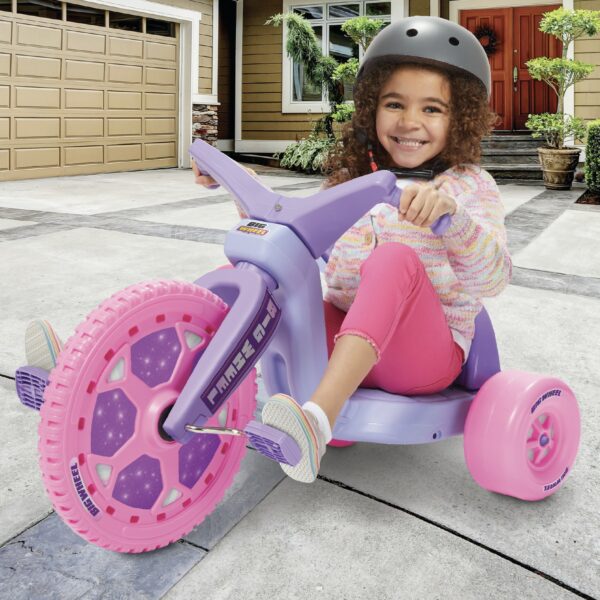 Girl with helmet on 16 inch Dazzler Big Wheel
