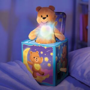 Pop and Glow Teddy Jack in the Box Lifestyle on a bed glowing
