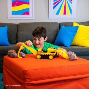 Tonka Trencher - Boy in Living Room scooping play rocks