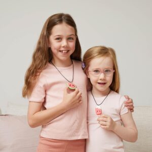 Tiger Tribe Clay Craft Sweeties Necklaces - Lifestyle shot two girls holding their finished necklaces and looking at the camera
