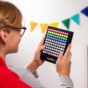 Lite Brite Touch Lifestyle Shot with child creating a design