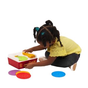 Lifestyle shot of girl playing with the Fisher-Price Music Box Record Player