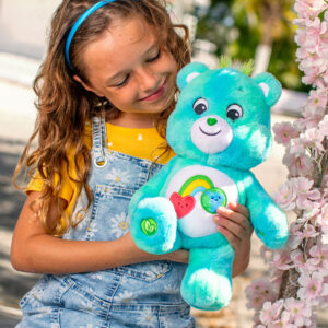 Care Bears Medium Plush - Lifestyle shot of girl holding bear