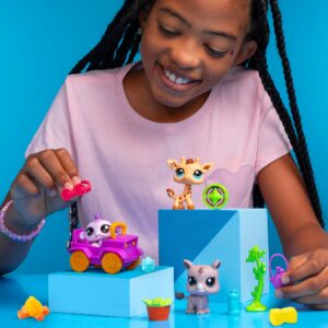 Littlest Pet Shop - Safari Play Pack - Lifestyle shot of girl playing with 3 animals and accessories