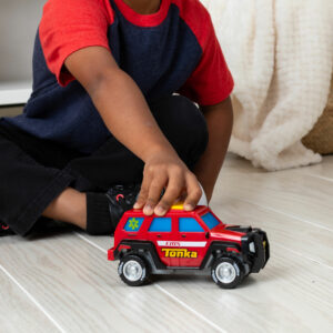 Tonka Mighty Force - First Responder - Lifestyle shot of boy playing with vehicle on the floor