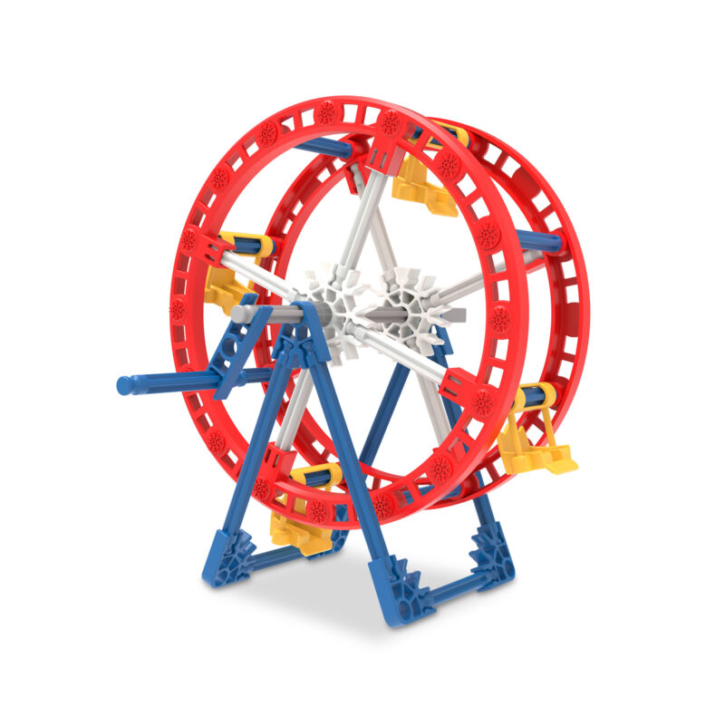 A small K'Nex ferris wheel model made out of colorful interlocking plastic pieces. The main structure of the wheel is red and white, with supporting beams in blue and yellow.