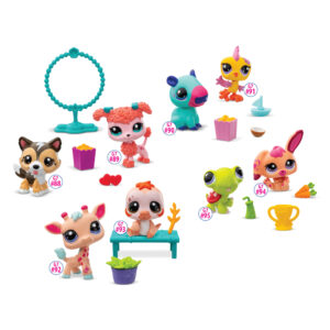 Toy animals from the Littlest Pet Shop series are posed with accessories like food, plants, a ring for animals to jump through, and a trophy. Figures include two dogs, a giraffe, a sloth, a capybara, a rooster, a turtle, and a bunny.