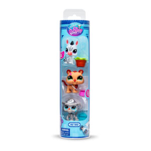 Packaging of a Littlest Pet Shop 'Pet Trio' set, featuring three toy figures in a vertical blister pack. At the top is a white zebra with black stripes and a pink nose, accompanied by a bucket of lettuce. In the middle is an orange lion with a star on its face. At the bottom is a gray monkey with blue eyes, next to a blue jar with a paw print. The packaging is blue with the Littlest Pet Shop logo at the top and age recommendation of 4+.