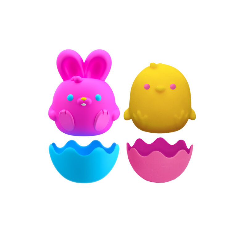 A small, colorful toy set with two characters: a pink bunny with a round body and long ears, and a yellow chick with stubby wings. Below them are two egg-shaped halves; one blue and one pink. The bunny and chick appear to be designed to fit into the egg halves.