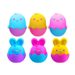 Six cartoonish egg-shaped characters are arranged in two rows. The top row features blue, yellow, and pink characters, while the bottom row shows the same characters but with bunny ears. Each character has a smiling face and is sitting in a cracked egg.