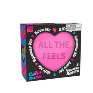 A boxed Nee Doh Color Change Squeeze Heart toy. The packaging is predominantly black with colorful accents, featuring phrases like "ALL THE FEELS," "Squeeze Me," "Love Me," and "Gift Me." The box also includes a choking hazard warning for small parts.