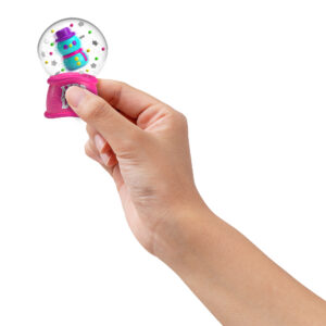 A hand on a white background squeezes the blue base of a Squish 'N Snow Globe between two fingers. The confetti and the blue snowman float around inside when the base is squeezed.