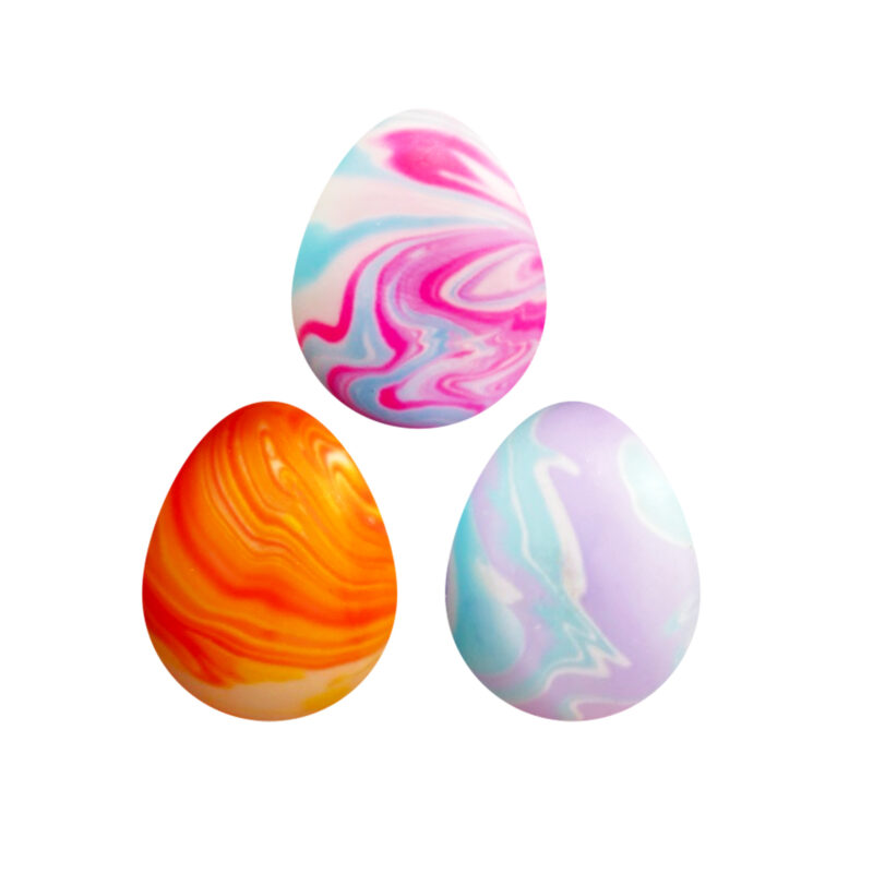 Three marbled eggs against a white background. The eggs feature swirled patterns in vibrant colors: the left egg is orange and white, the top egg is pink and blue, and the right egg is purple and blue.